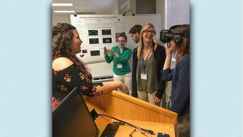 Dr. Gallis' students explain their recent physics projects.