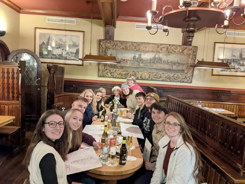 Business student group at dinner in German brauhaus