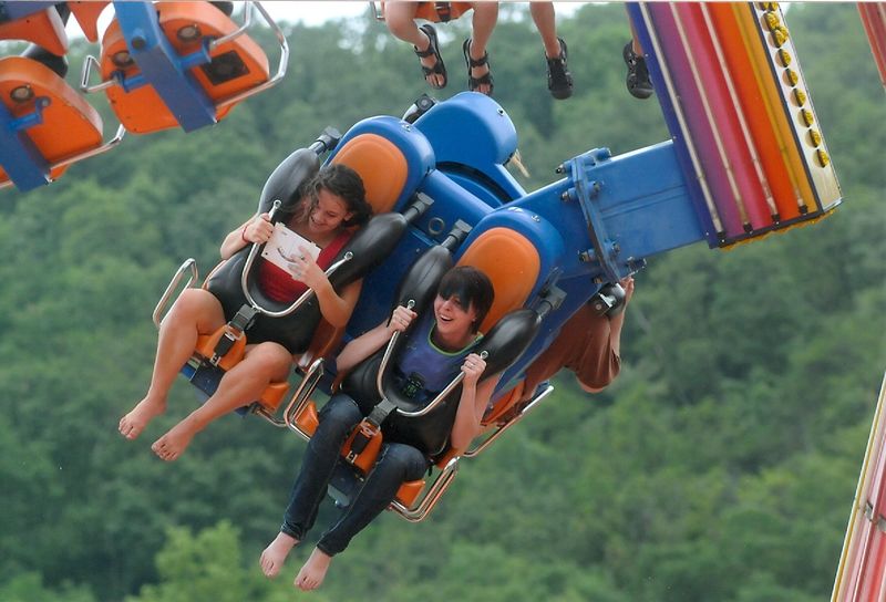 Two students are strapped in to a thrill ride at Knoebels Amusement Park