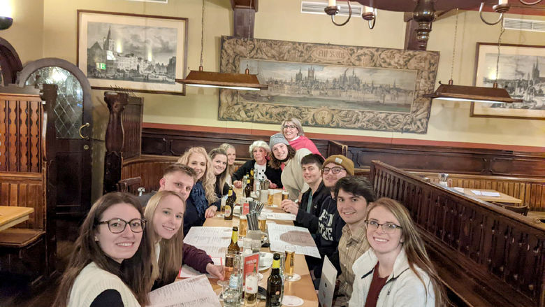 Business student group at dinner in German brauhaus