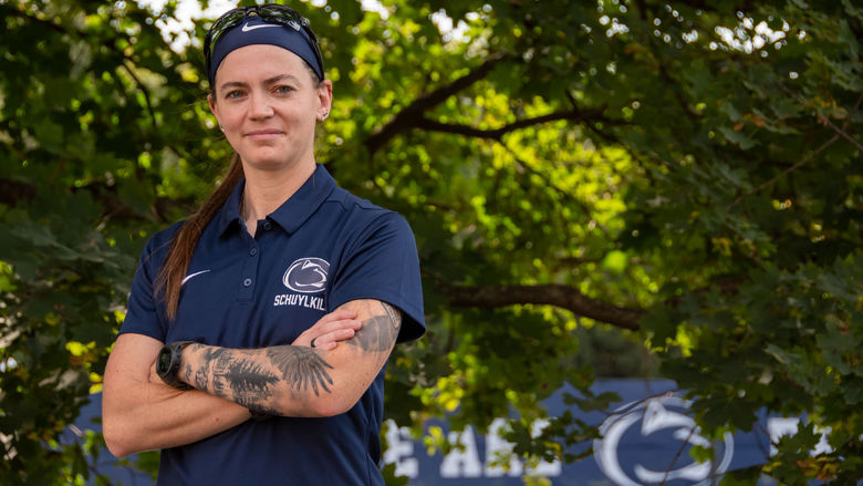 An image of Kate Fullerton with Penn State Schuylkill outdoor athletic courts in the background