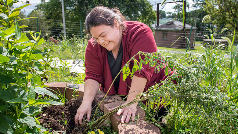 Mary Ann Smith, lecturer of biology at Penn State Schuylkill, cares for native plants on campus.