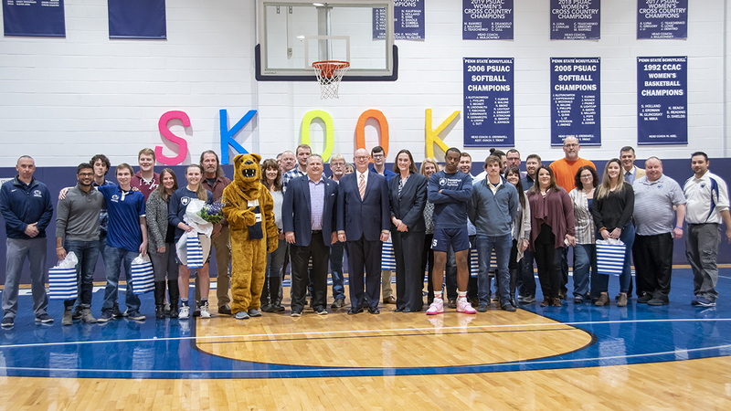 Group of students, faculty, coaching staff, and families.