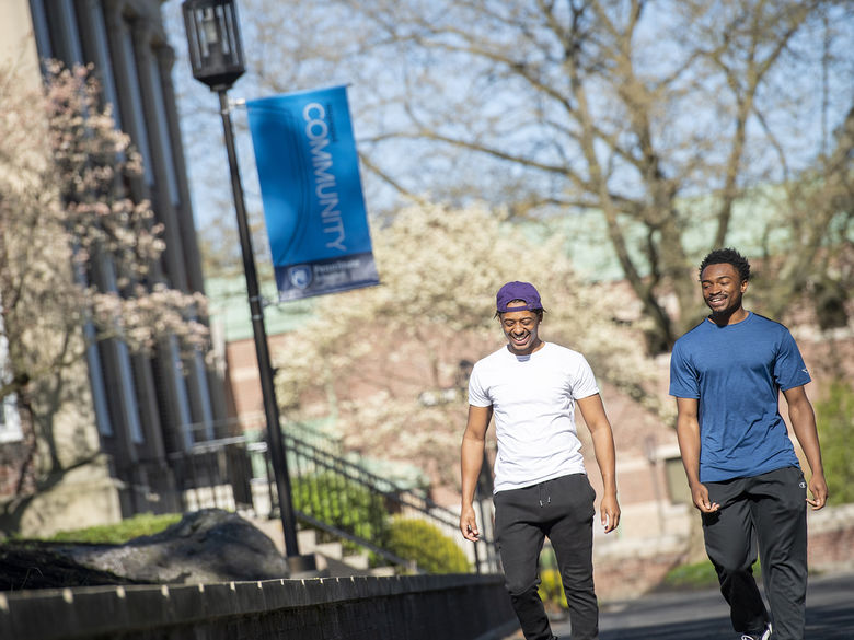 Two male students walk down Penn State Schuylkill Mall Walk.