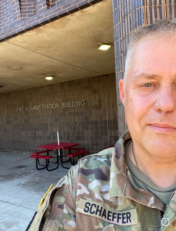 Man takes selfie photo in military uniform.