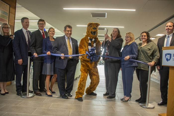 Key players in the dining center renovation and expansion project pause to cut the ribbon