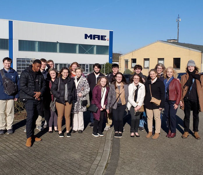 Image of Schuylkill business students in front of MAE Group, the German manufacturer they visited.