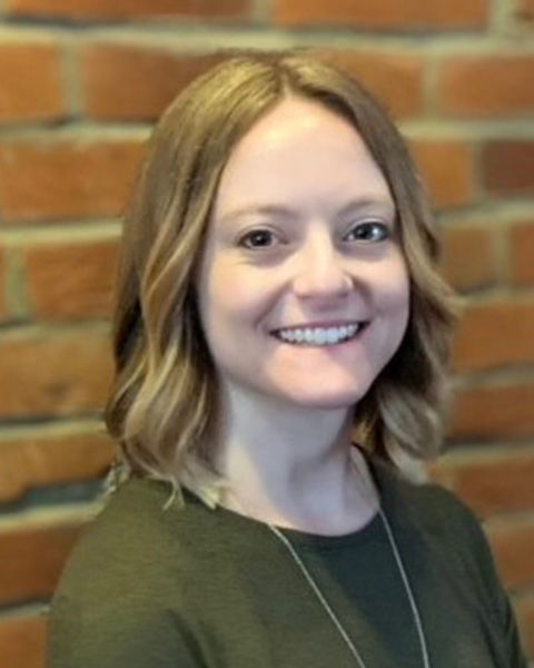 Caucasian female Erin Weaver, against brick background