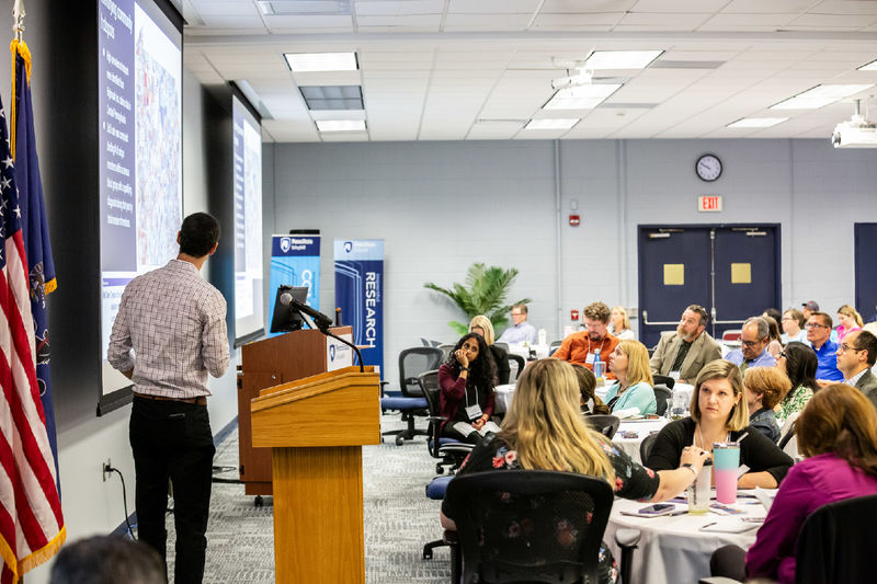 Dr. Danny George presents to the audience at CTSI's Community-Driven Research Day