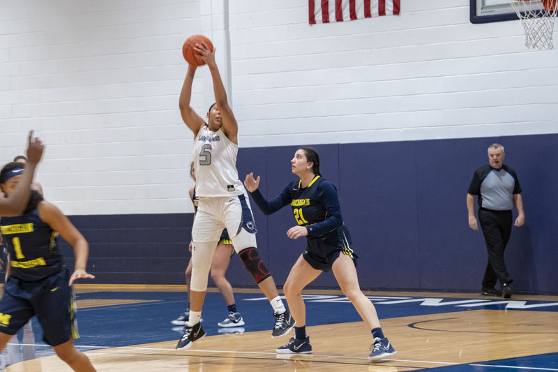 A Schuylkill women's  basketball player grabs a rebound.
