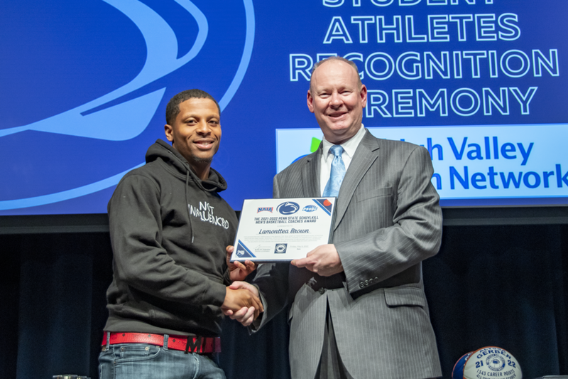 A male student-athlete on stage.