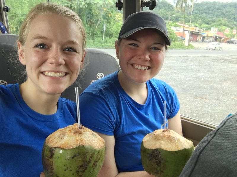 Schuylkill campus students Marla (left) and Alyssa (right) hydrate by sipping on some fresh coconut milk.
