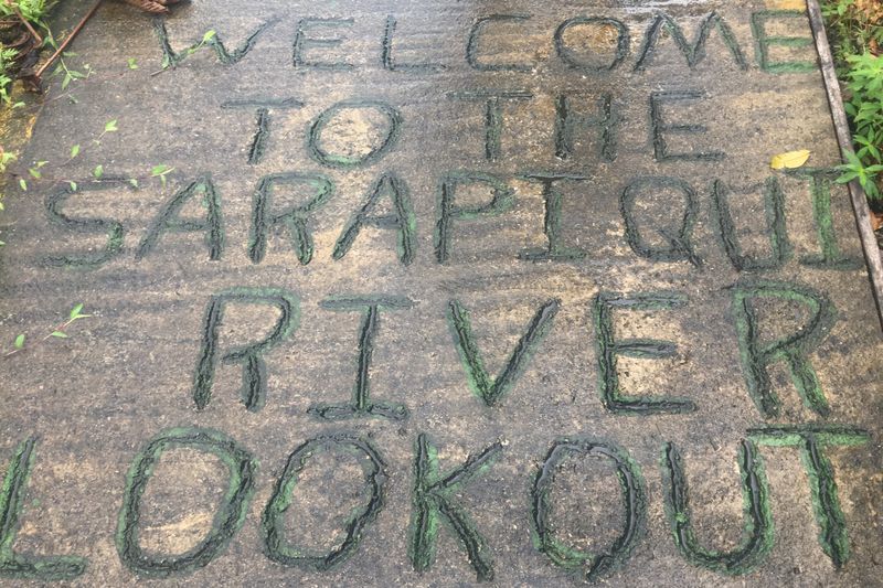 A message in the stone welcomes visitors to the Sarapiqui River lookout.