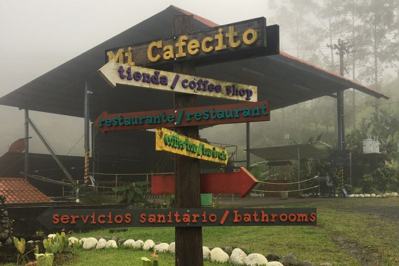 A pole directs visitors to a number of places on this Costa Rican coffee plantation.