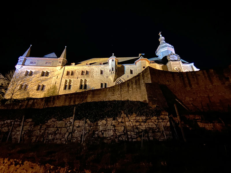 An image of Marburg Castle at night.