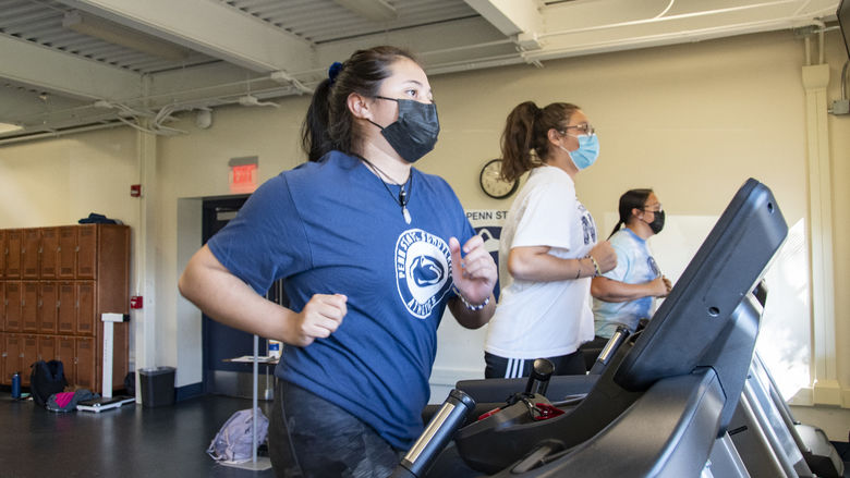 Three Penn State Schuylkill students using treadmills
