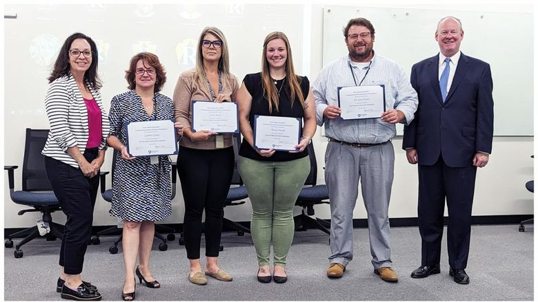 Group of employees from Pa. Dept. of Revenue receiving their Green Belt certifications after completing Lean Six Sigma programming.
