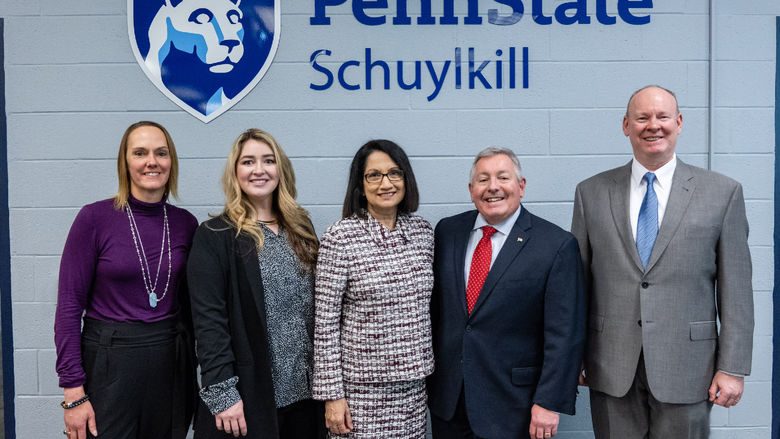 Staff from the Schuylkill Chamber of Commerce and Penn State Schuylkill pose with Penn State President Neeli Bendapudi