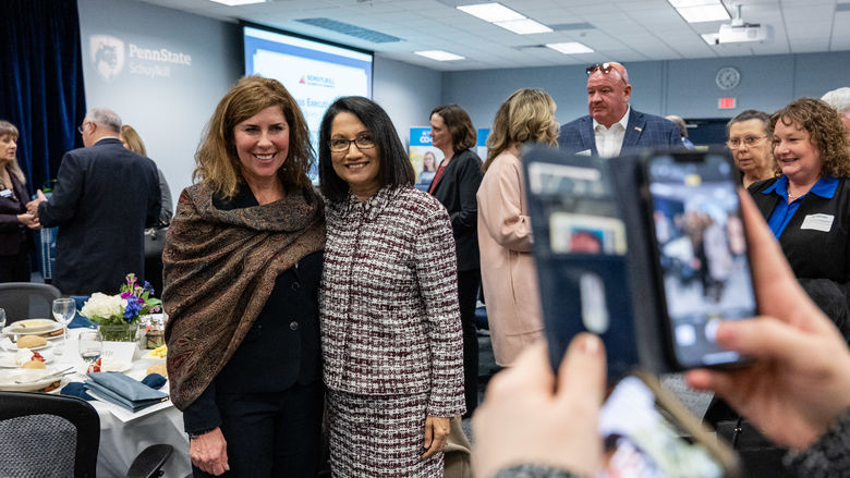 A cell phone photo is taken of two women