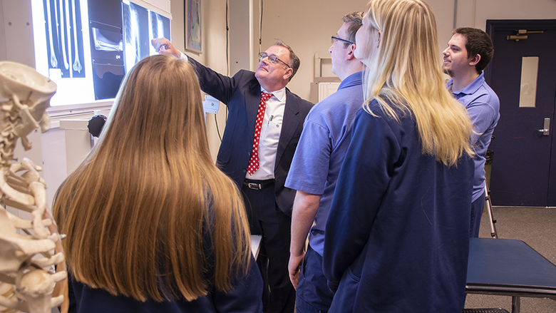 Schuylkill lecturer Tom Sandridge reviews x-rays with Radiological Sciences students.
