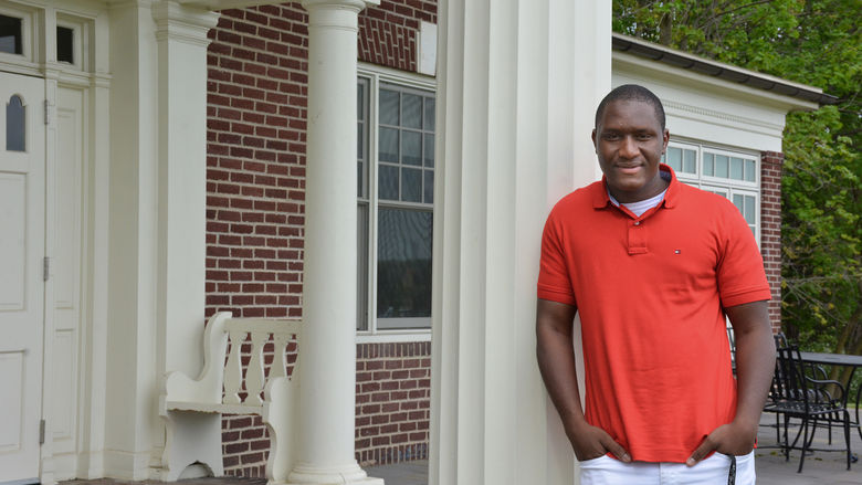 Harunah Barry, a Penn State Schuylkill honors student, poses in front of the campus' Kiefer-Jones Building.