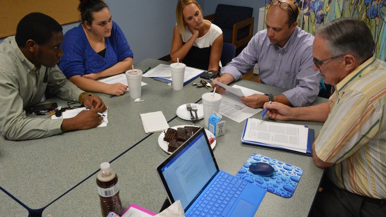 Students and mentors of the ESTEEM program work together in a roundtable discussion