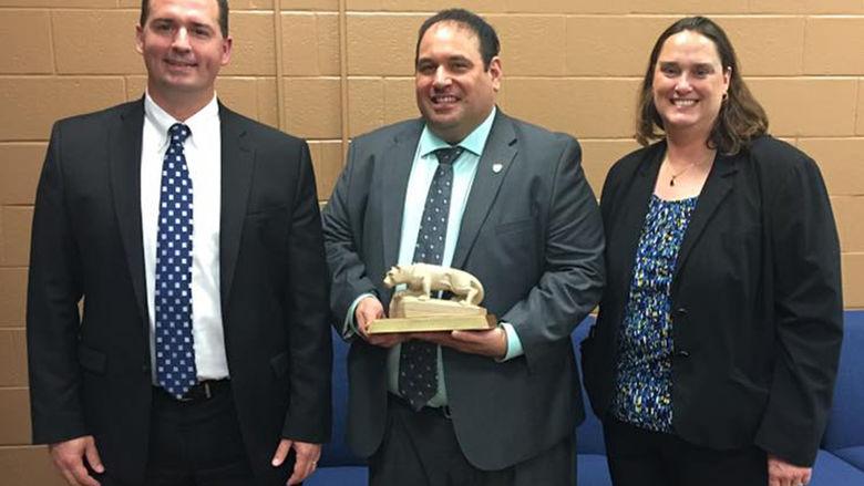 Jonathan Kukta (center) was recently honored with Penn State Schuylkill's Outstanding Alumnus Award. 