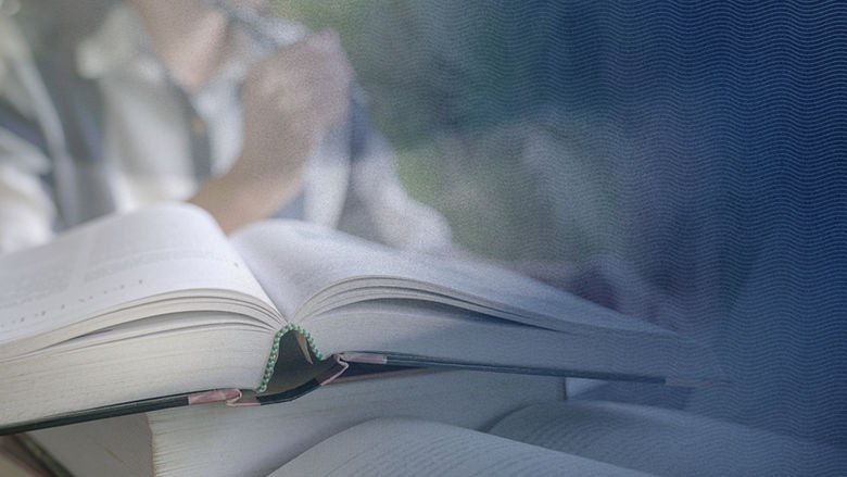 Textbooks in focus with out of focus student in background and blue gradient overlay with s-curve design
