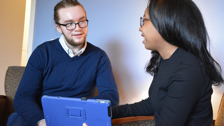 Students Brett and Alexis discuss their papers