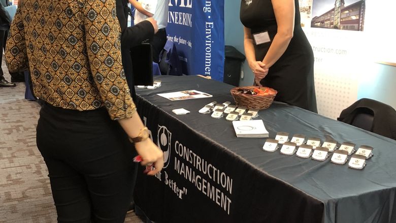 Student talking to company representative