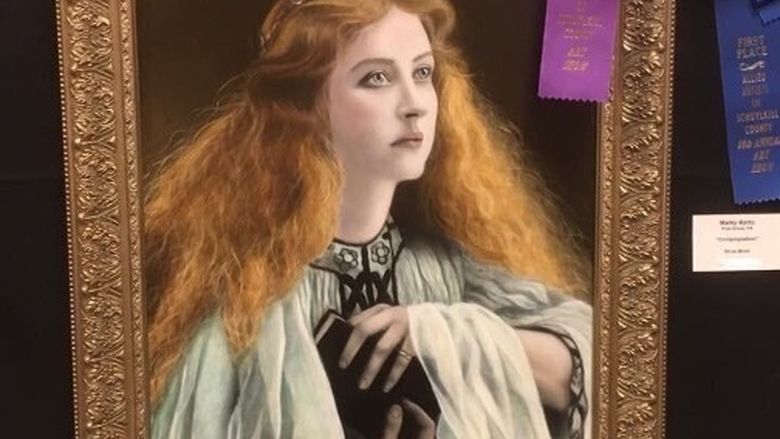 Gold framed oil painting of a young woman with curly red hair draped in robes and carrying a book. Prize ribbon in upper righthand corner.