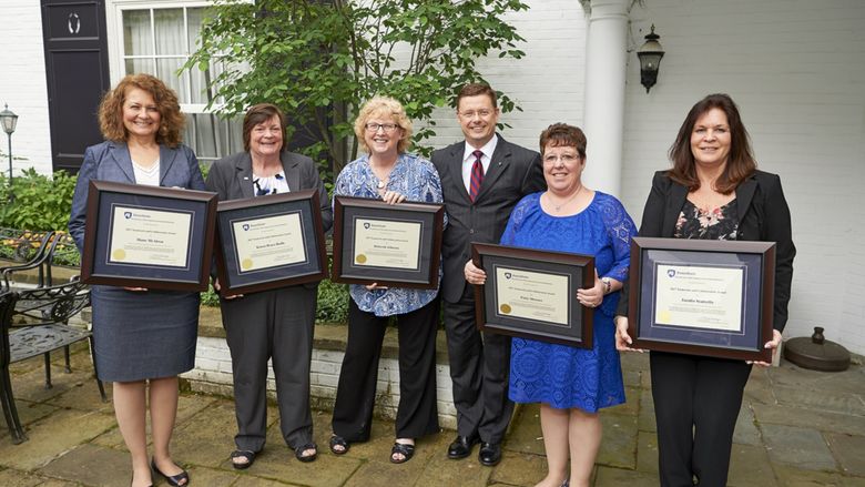 Members of the 2017 Teamwork and Collaboration Award gather for a photo with O. Richard Bundy, vice-president for development and alumni relations
