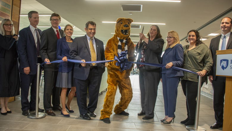 Key players in the dining center renovation and expansion project pause to cut the ribbon