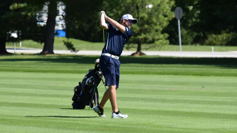 Student golfer tees off