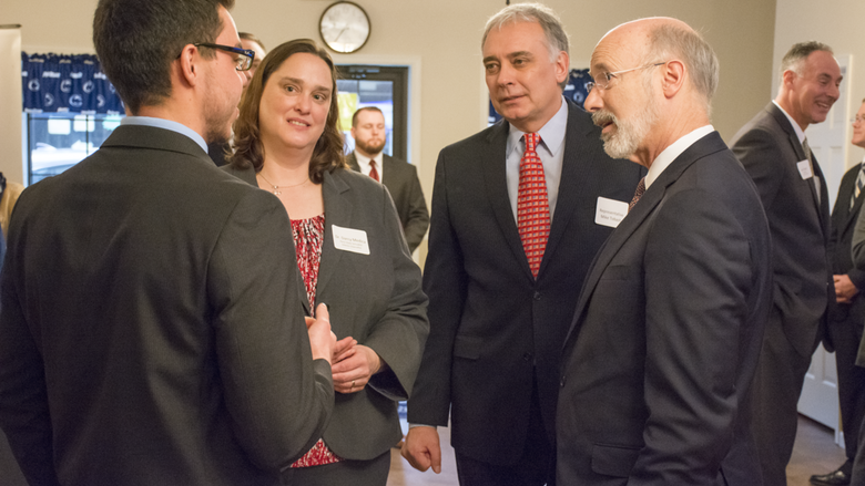 Governor Tom Wolf speaks to Carmen Cicioni, a seed money winner from Schuylkill's LionLaunch program.