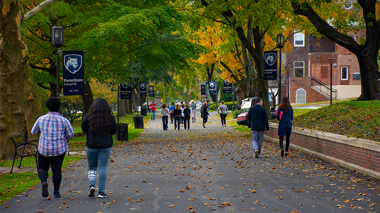 Students, staff, and faculty enjoy a fall day on Penn State Schuylkill's mall walk.