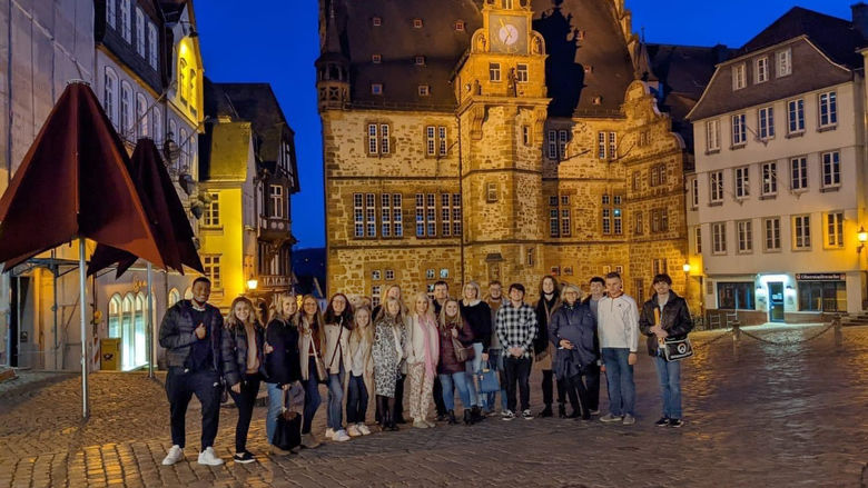 An image of Penn State Schuylkill Students posing on the cobblestone streets of historic German town.