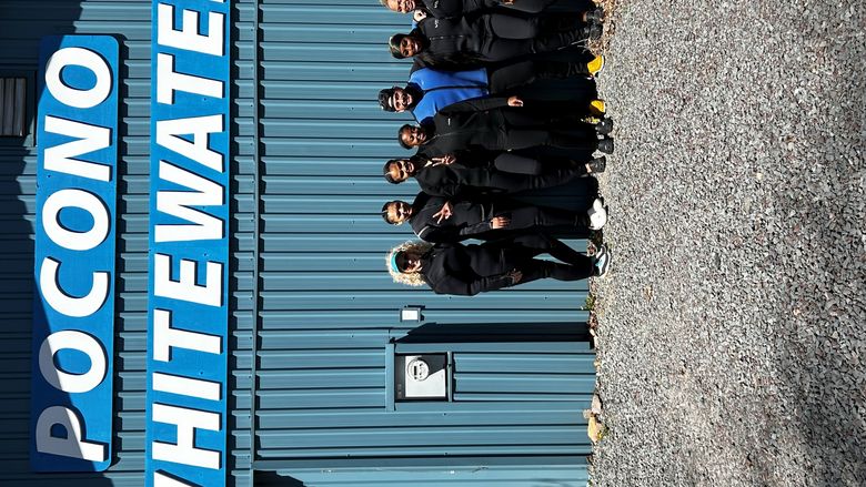 group of people standing in front of a building 