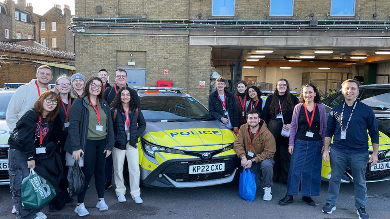 Students of the course CRIMJ 499 Serial Killers and European Criminal Justice next to a London police vehicle.