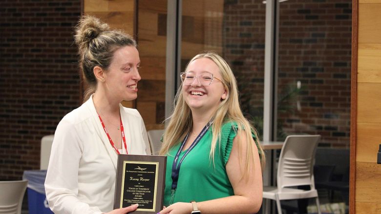 Kacey Harper receiving the PCA Voices of Tomorrow College Communicator Award