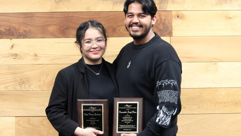 Kyla Valerie Guillermo receiving the Top Graduate Student Paper award and Karandhir Singh Flora reviving the second runner-up in the Undergraduate Writing Competition award