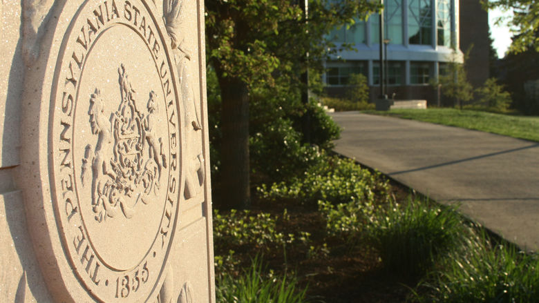 The Pennsylvania State University seal in back of the HUB