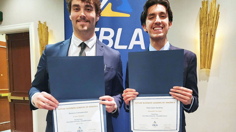 Students hold awards