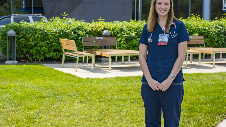 Anastasia Barnhardt poses outside of the hospital where she works.