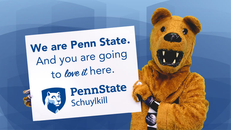 Penn State Nittany Lion mascot holding a sign that reads "We are Penn State. And you are going to love it here," written on it above the Penn State Schuylkill logo.