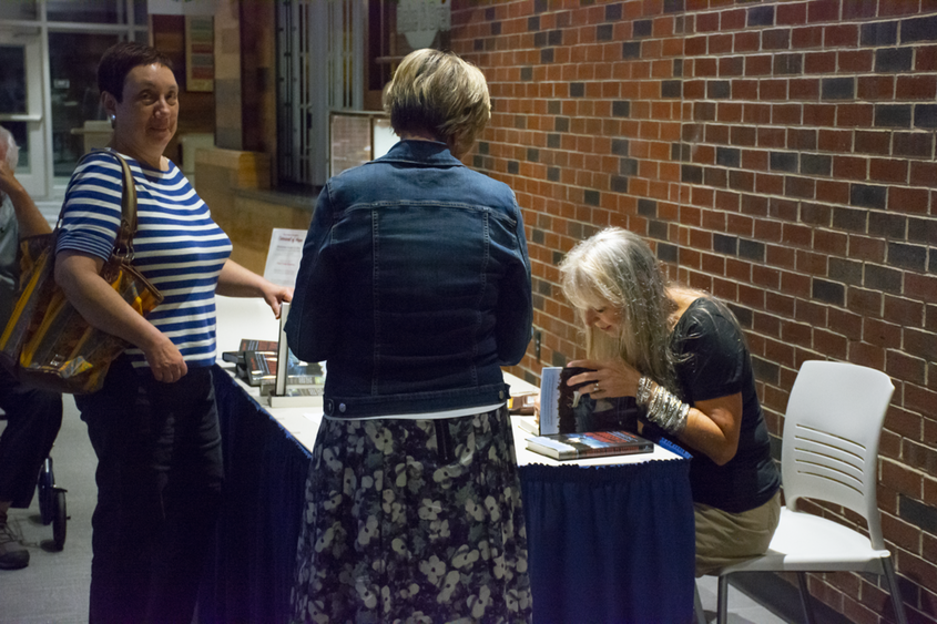 Cindy Ross signs books for waiting fans