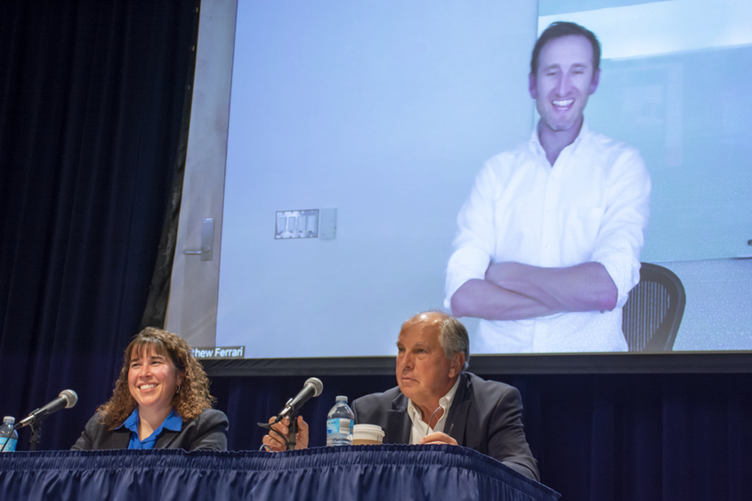 Panelists speaking at Novel Control Measures to Combat Infectious Diseases sit on stage at Penn State Schuylkill and answer audience questions.