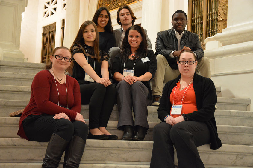 Seven Schuylkill campus students gather on the Pennsylvania capitol building's rotunda stairs after rallying their state representatives.
