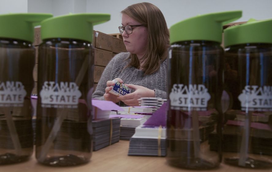 A student organizes stickers 