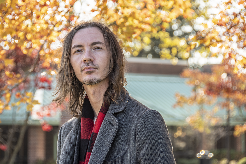 A picture of Art Zilleruello with a background of autumn leaves